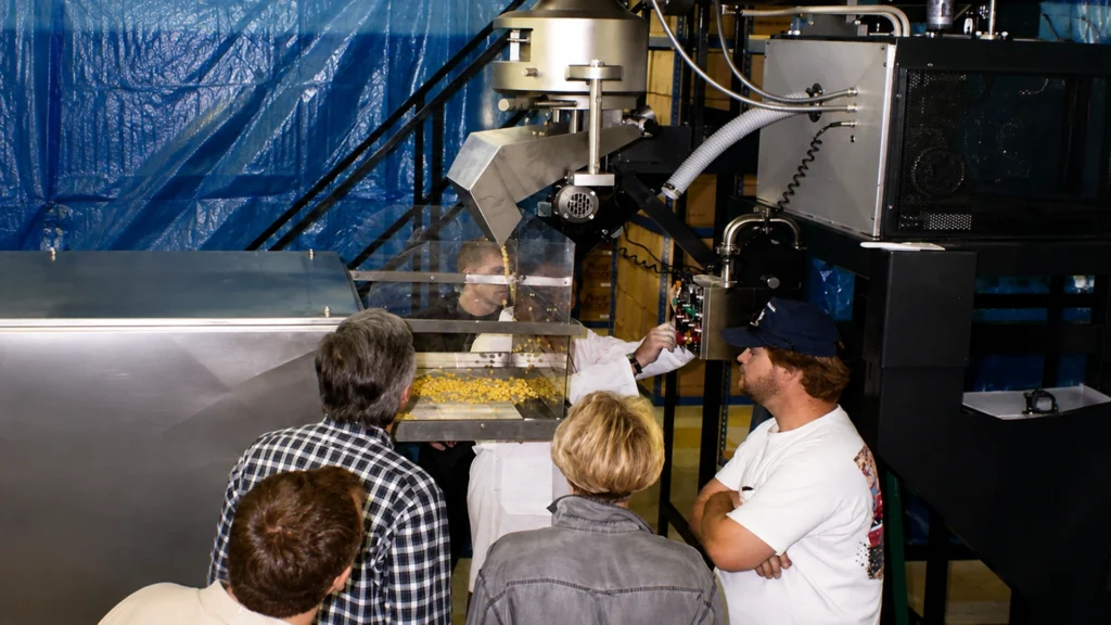 Commercial pasta machine producing fresh long pasta in a production facility